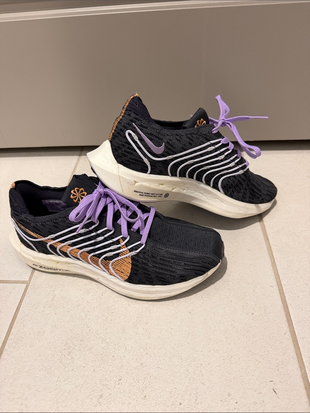 Nike Women’s Running Shoes with Lavender Laces and Orange Accents